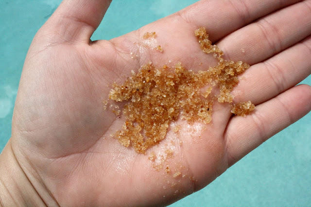 A Girl's Gotta Spa Energizing Citrus Salt Scrub in hand